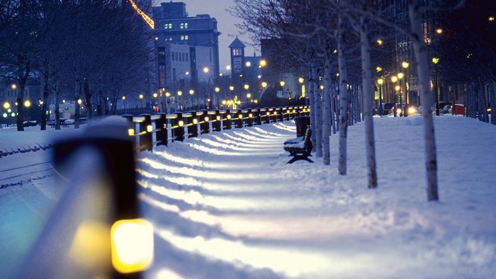 Winter city street with lights and snow