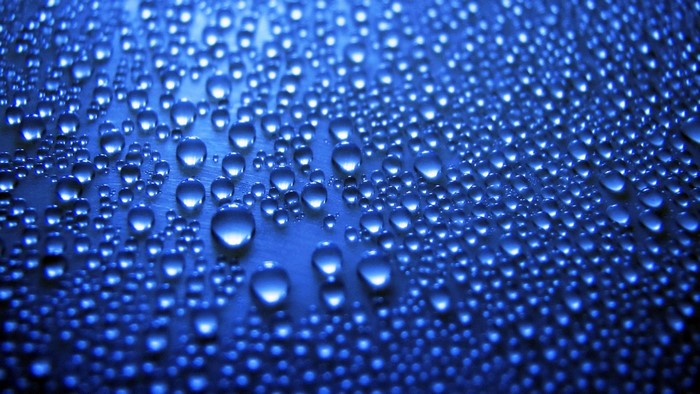 Blue Water Droplets on a Surface