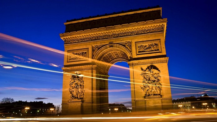 Arc de Triomphe at night with light trails
