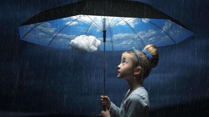 Girl under an umbrella with sky inside