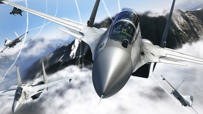 Fighter jets in formation over mountains