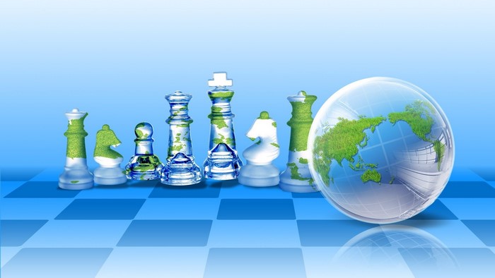 World Chess Pieces and Globe on Chessboard