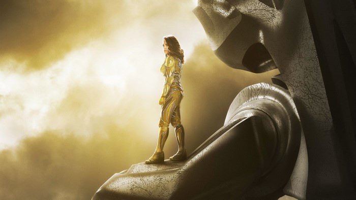 Yellow Ranger from Power Rangers on a giant statue