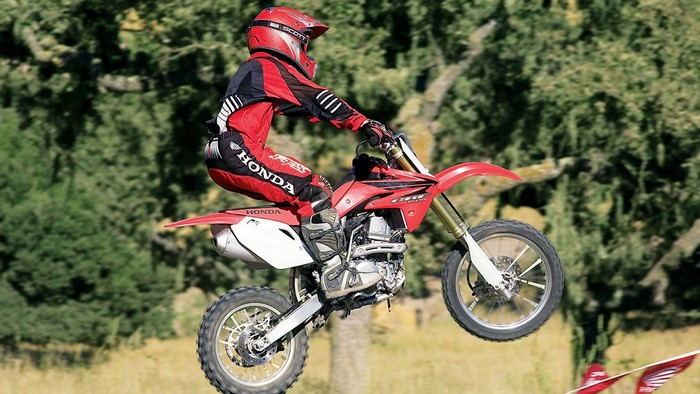 Honda Motocross Rider in Mid-Air Jump