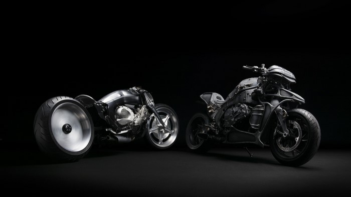Two custom motorcycles on a black background