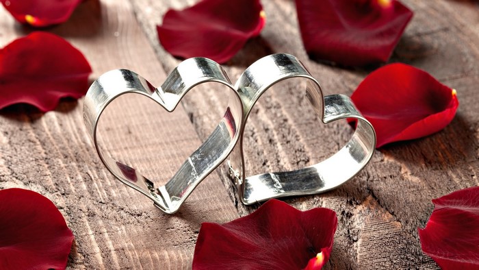 Two hearts cookie cutters with rose petals