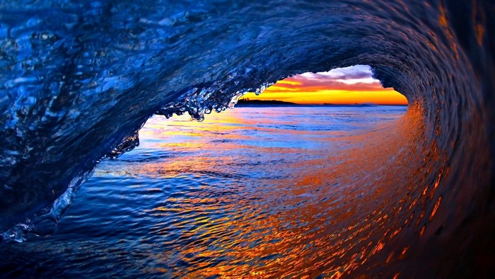Ocean wave at sunset