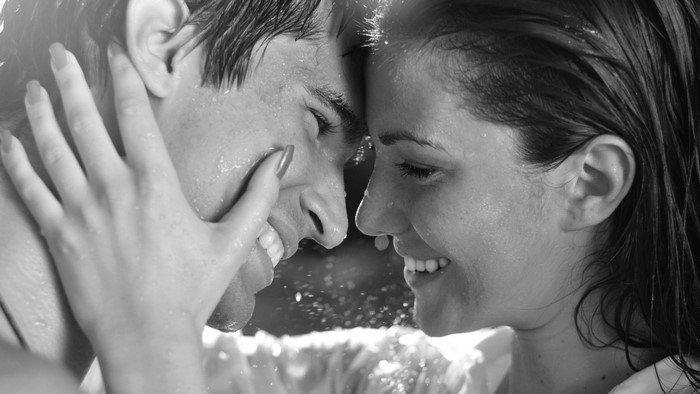 Couple embracing in the rain