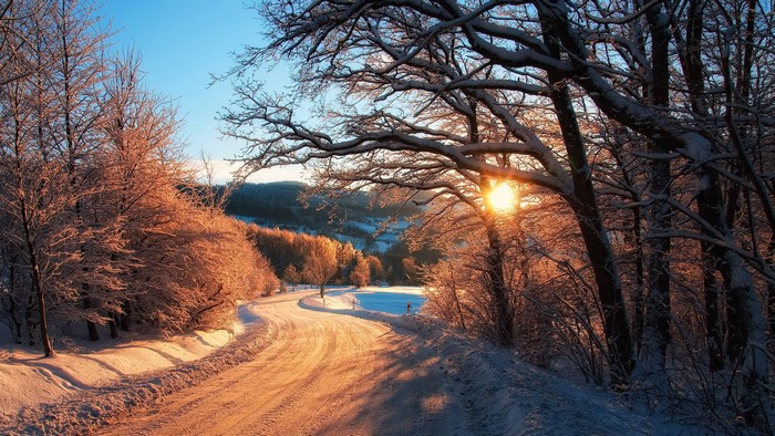 Winter road at sunset