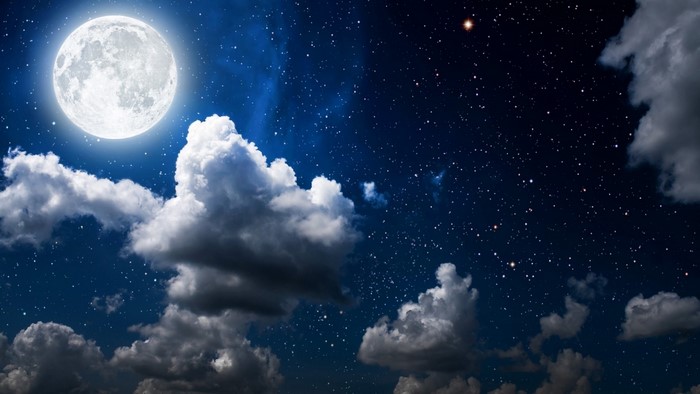 Full Moon and Stars in a Cloudy Night Sky