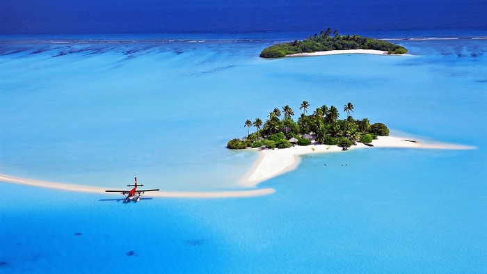 Seaplane near tropical islands in the ocean
