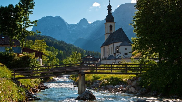 Church and bridge over a river in Germany