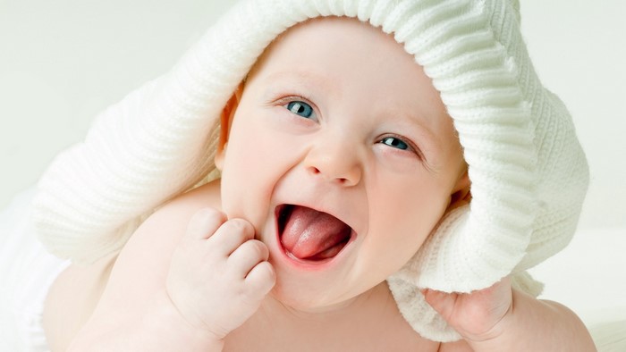 Cute Baby with Blue Eyes and White Hat