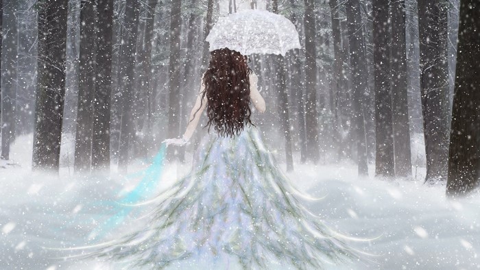 Girl with umbrella in snowy forest