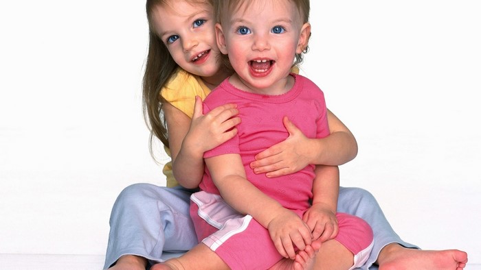 Two young girls smiling
