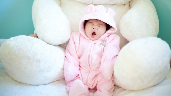 Cute Baby Yawning in Pink Bear Costume
