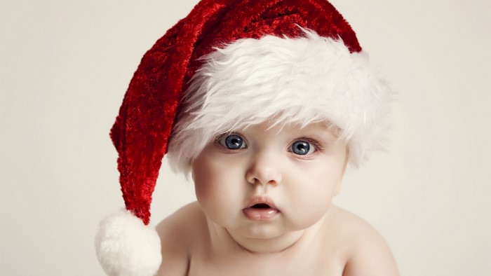 Baby wearing a Santa hat
