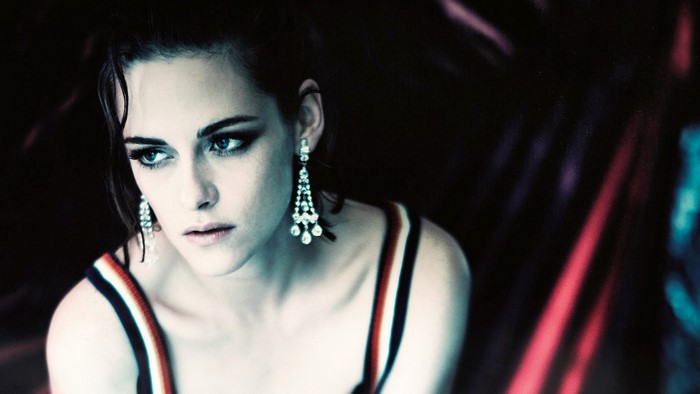 Kristen Stewart wearing a striped top and diamond earrings