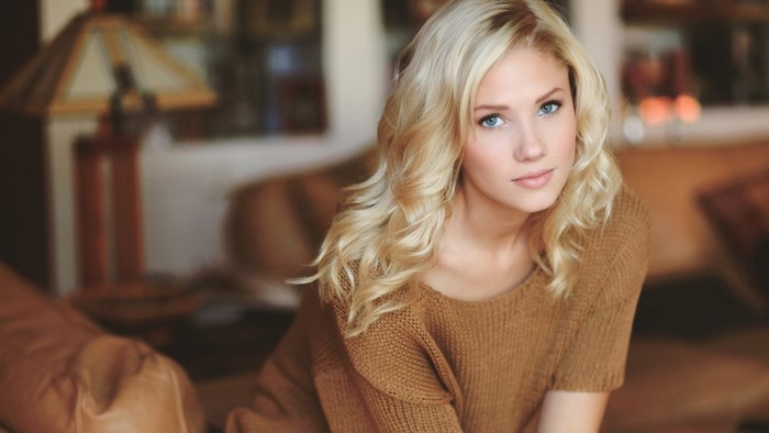 Cute blonde model girl with blue eyes