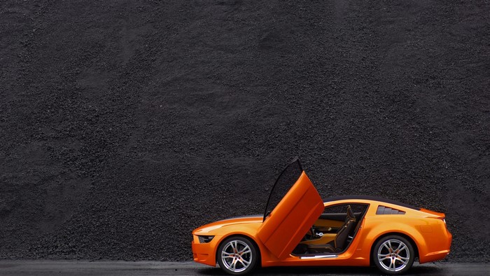 Orange Ford Mustang Giugiaro Concept car with doors open