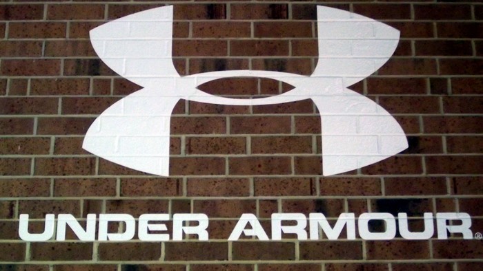 Under Armour logo on brick wall