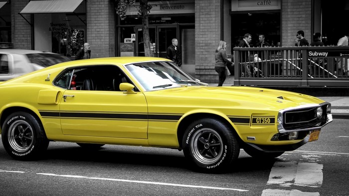 Yellow 1969 Ford Mustang GT350 on City Street