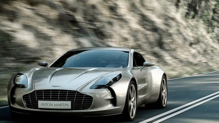 Aston Martin One-77 driving on a road