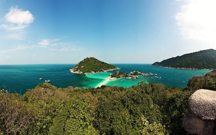 Tropical islands with turquoise water and lush green hills