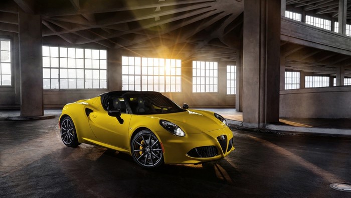 Yellow Alfa Romeo 4C Spider in a warehouse