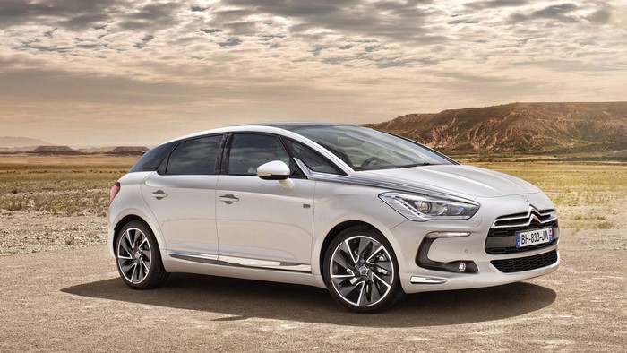 White Citroen DS5 parked on dirt road