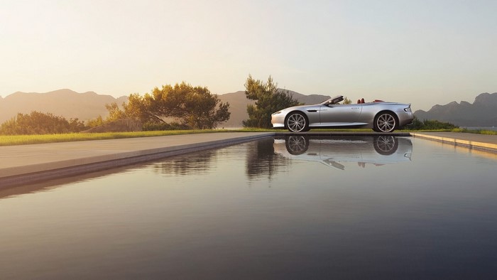 Silver Aston Martin DB9 Volante convertible by infinity pool