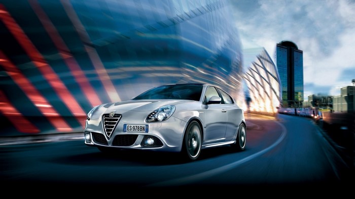 Alfa Romeo Giulietta driving on a city street