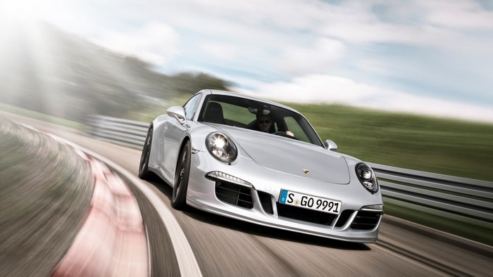 Silver Porsche 911 on a Racetrack