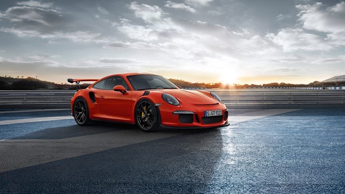 Orange Porsche 911 GT3 RS on a Racetrack