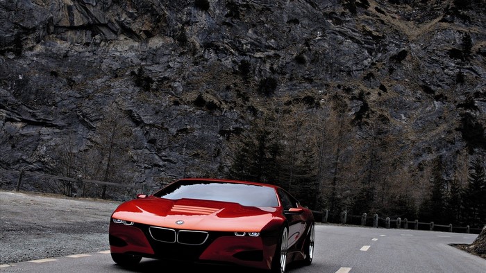 Red BMW M1 Concept Car on Mountain Road