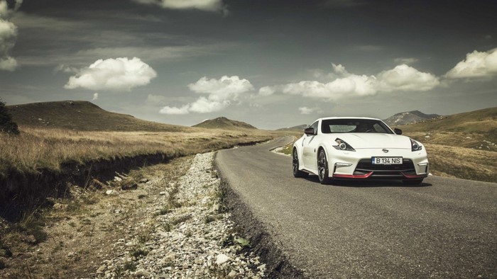 White Nissan 370Z on a winding road