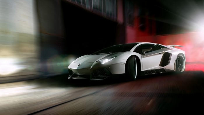 White Lamborghini Aventador driving at night