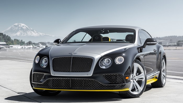 Bentley Continental GT on an airfield with a mountain in the background