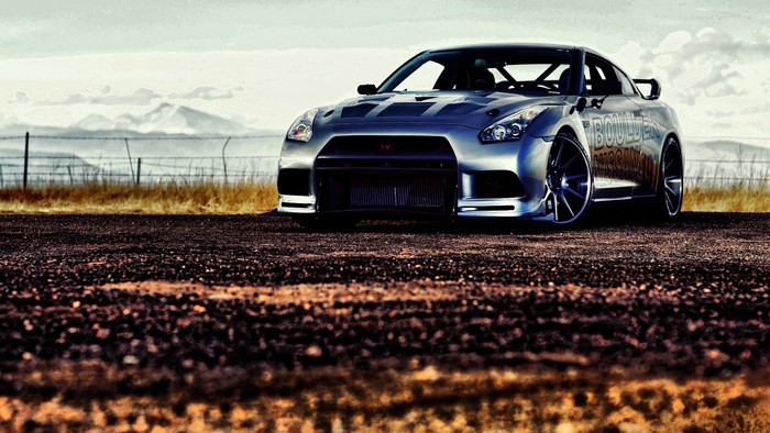 Silver Nissan GT-R R35 on a dirt road