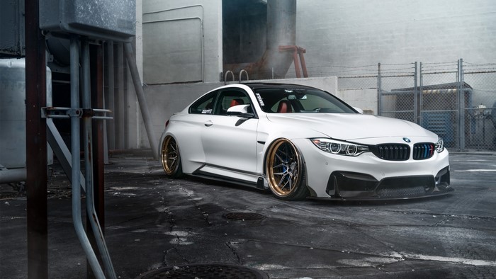 White BMW M4 with custom wheels