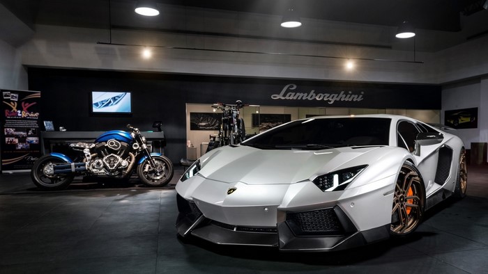 White Lamborghini Aventador Novitec Torado and blue motorcycle