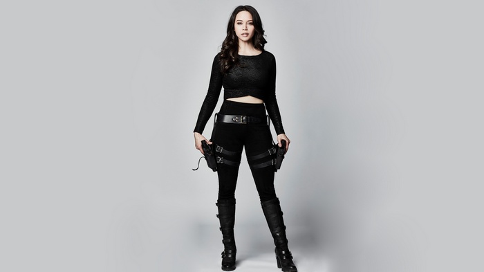 Melissa O'Neil in tactical gear with guns