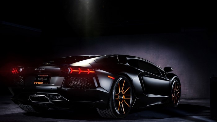 Black Lamborghini Aventador with custom wheels