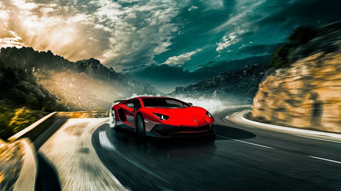 Red Lamborghini Aventador SV driving on a mountain road