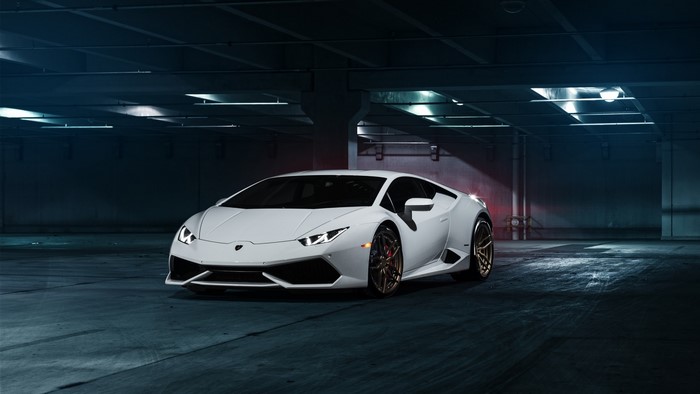White Lamborghini Huracan in parking garage