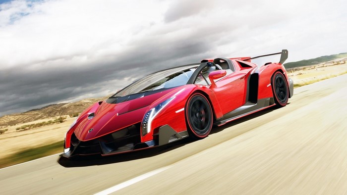 Red Lamborghini Veneno Roadster driving on a road