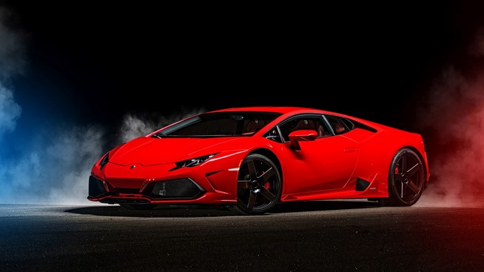 Red Lamborghini sports car with smoke effects