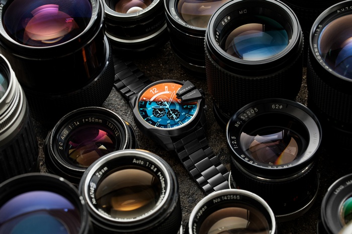 Diesel Watch surrounded by DSLR Lenses