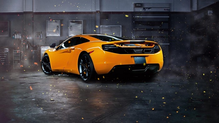 Orange McLaren MP4-12C in a garage