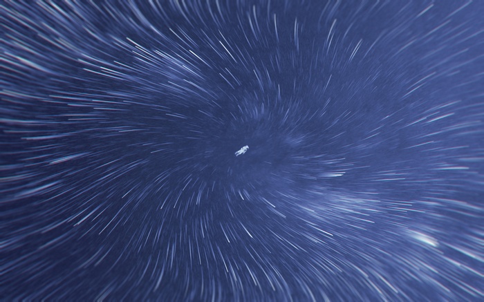 Astronaut floating in a star trail vortex
